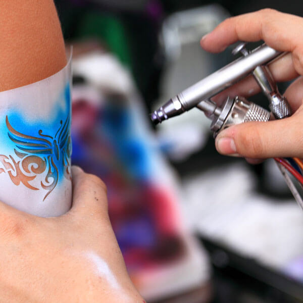 airbrush tattoo artists available for festival booking in Dallas, TX, and surrounding areas