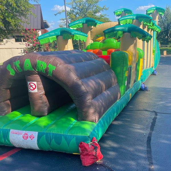 Obstacle courses, bounce houses, and slides available to rent for events