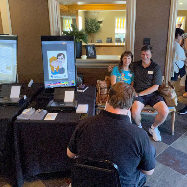 digital caricature artist drawing happy couple on tablet in Dallas-Fort Worth, TX