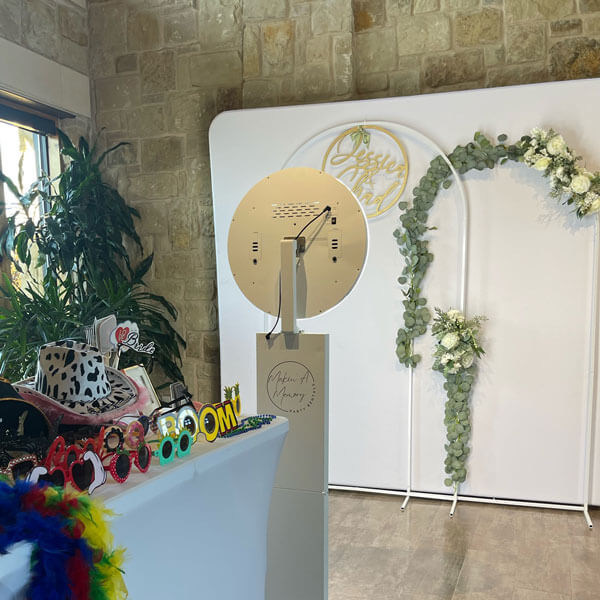 social photo kiosk at wedding with accessories